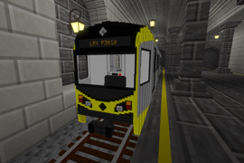 An LRV P3010 waits at the platform.